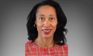 interview with Girls Inc.'s Stephanie Hull: headshot of black woman with shoulder-length hair in red plaid-patterned shirt