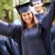 DEI in colleges: young woman in graduation garb celebrating