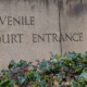 juvenile court: stone entrance to juvenile court building with flowers in front