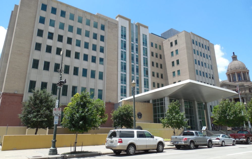 Houston-area justice-involved youth repeat offenders: county juvenile court building against blue sky