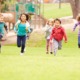 California, Arizona, Nevada child and health grants: group of young children running in park towards camera
