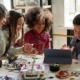 gifted children and disadvantaged student STEM program grants: diverse children work on STEM project at table