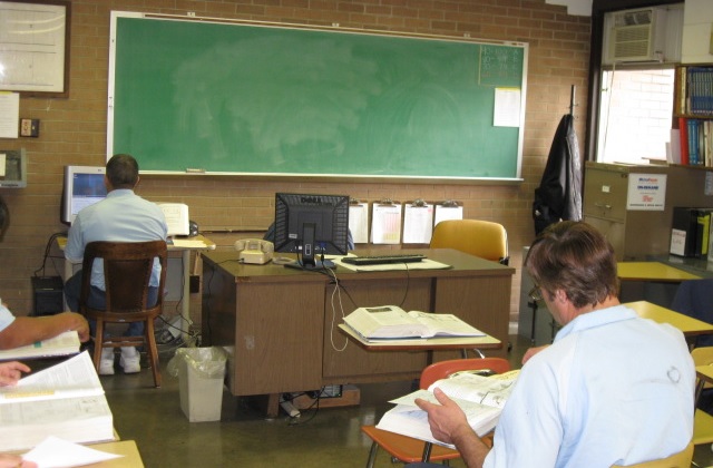 Former juvenile lifers reentry preparation analysis: old looking classroom with chalkboard and people working