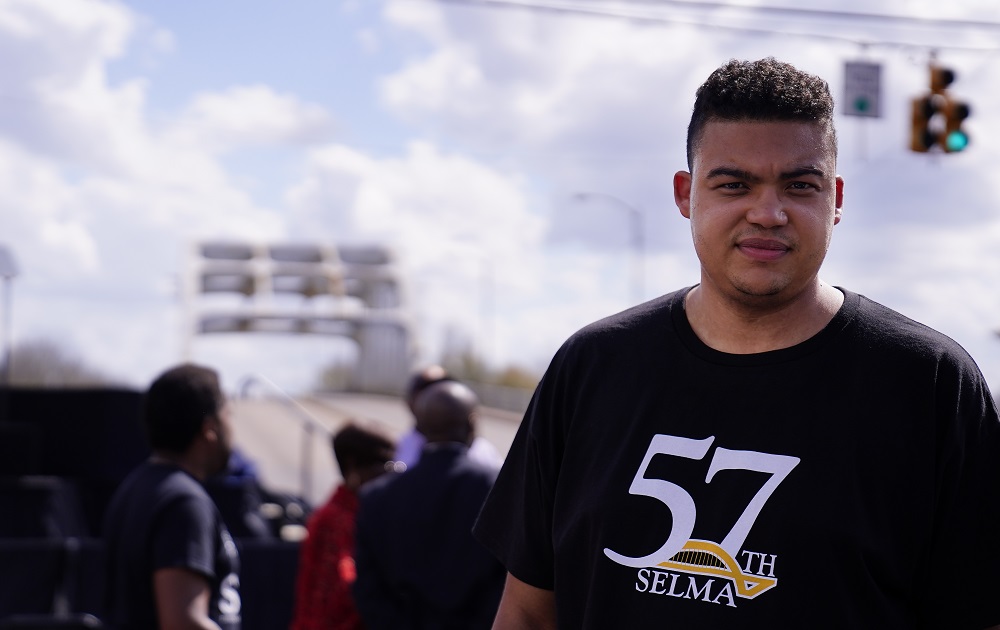 Selma youth voting rights activism: young minority youth looking at camera during march