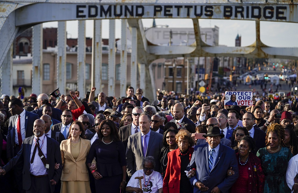 Selma youth voting rights activism: Black leaders and others march across Edmund Pettus Bridge