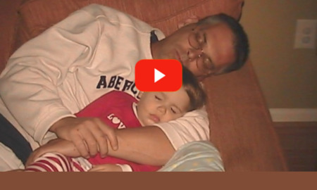 restoration, not prison video: screenshot of man and son sleeping on couch
