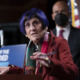 Rep. Rosa DeLauro Q&A on afterschool and child tax credit: older woman with blue hair speaking at podium with hand raised