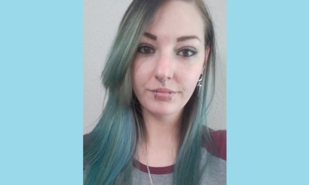 Missouri boarding school abuse: selfie photo of young woman with colored hair and piercings