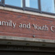Teen court: Red brick building with close-up of sign in silver letters reading "Family and Youth Court""