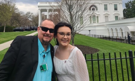 transgender medication law in Alabama blocked by judge: father and daughter stand outside the White House smiling