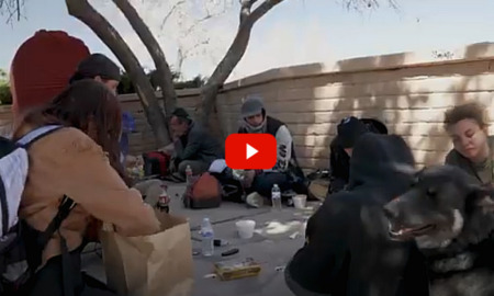 Homeless New Mexico youth: Circle of homess teens sit in circle on cement under leafless tree