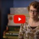 Being Michelle documentary: short-haired woman with glasses sits in a room