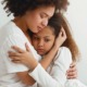 children exposed to violence, family violence grants: mother comforting her young, sad daughter