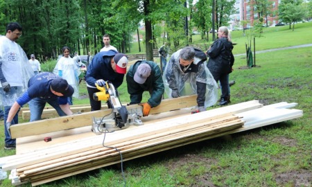 DC region community grants: group of people woodworking for community project in park