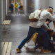 Ticketing students: Three teen boys fighting in school corridor