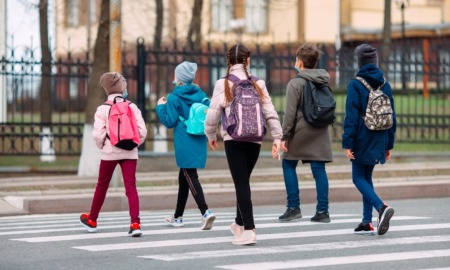 Youth violence expert how to help antisocial youth: group of school kids walking across crosswalk