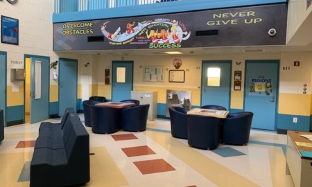 Connecticut turnaround of juvenile system sets standard: common area of juvenile facility with bright colors and motivational banner