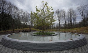 Sandy Hook memorial opens: image of round water feature with tree in the middle