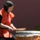 Japanese-American community grants: Japanese woman playing large, traditional drum