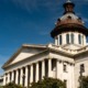 SC committee advances limits to classroom teaching on race: South Carolina state house building against blue sky