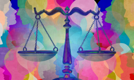 Justice: Scales of justice in front of multi-colored illustration of overlapping profiles of people.
