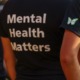 pandemic youth mental health toll unprecedented: view of person wearing black t-shit with "Mental Health Matters" on the back