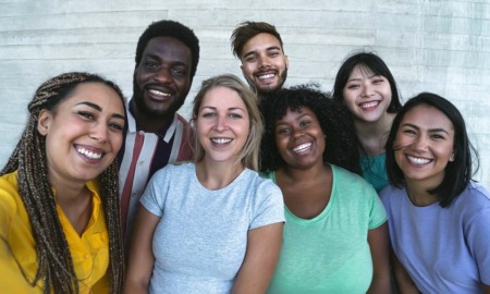 preventing and ending youth homelessness report: group of diverse youth smiling at camera
