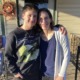 Transgender youth: 'Forced outing' bills make schools unsafe: boy and his mother side-hugging on steps in front of house while smiling