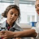 Gender equity in STEM grants: woman and girl work on STEM project together