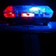 Police and Foster Care: Close-up of red and blue light on top of car roof
