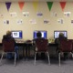 Veto stands_Transgender pronouns OK in North Dakota schools: students at computers in a classroom with decorated wall