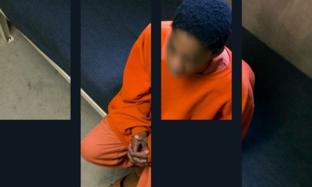 mass incarceration of children report: young black boy in orange jumpsuit sits in cell