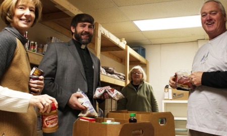 West Virginia and Ohio basic needs services grants: group of smiling people working at food pantry