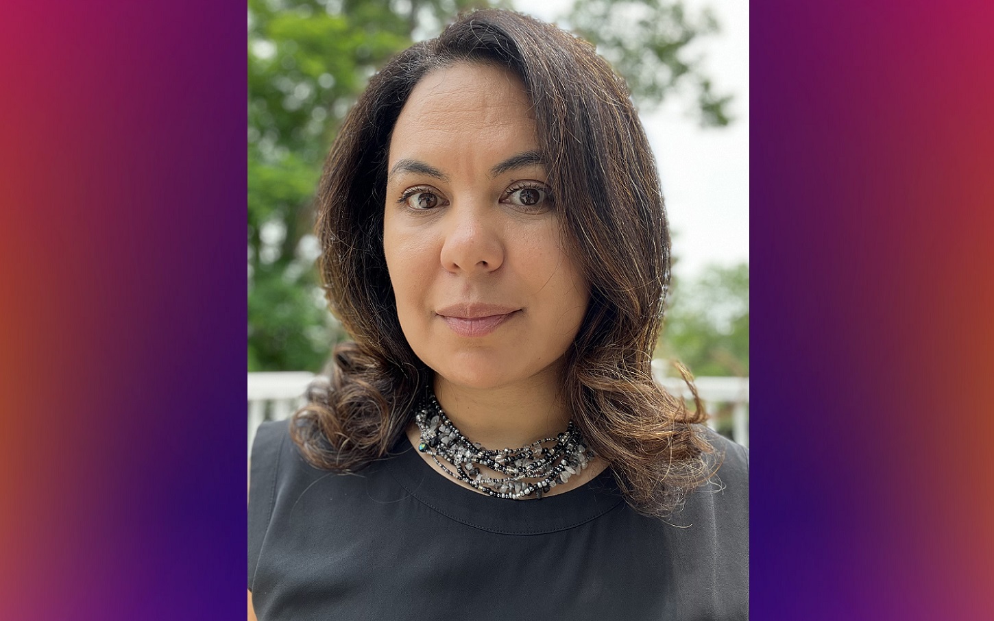 Nicole Rodriguez Leach named executive director of Grantmakers for Education: woman with medium length dark hair and and dark shirt outside