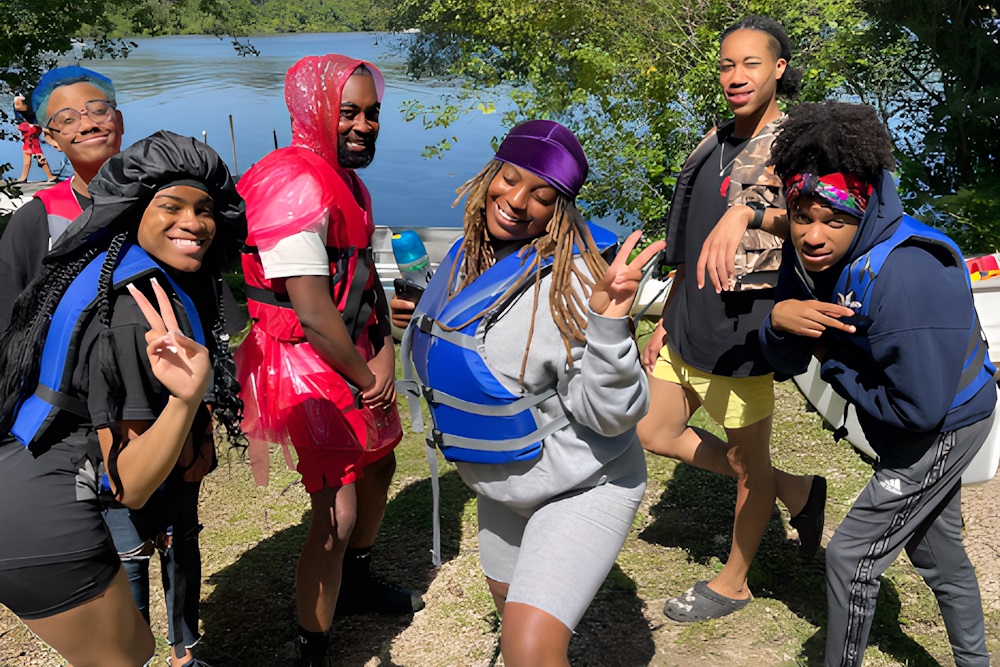freedom schools: group of teens in lifejackets having fun at lake