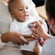 child health research, pediatric research project grants; african american baby at doctor's office