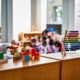 Daycare owners and parents say they are at a breaking point as federal relief funds end: daycare room seen from behind shelves with colorful toys on top