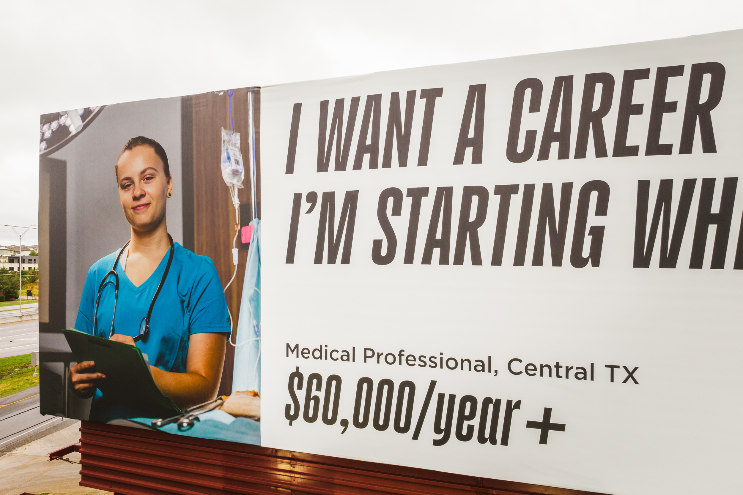College campaign: Close-up view of billboard with image of person on left side and text "I want a career. i'm starting ... Medical Professional, Central TX. MakeItMovement $60,000/year+"