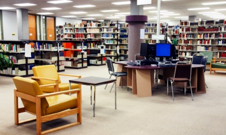 Native American community library support grants: library with computer stations and bookshelves