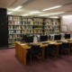 Native Hawaiian library support grants: row of computers at desks with bookshelves background
