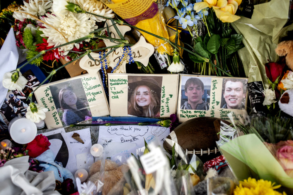 School shooting: Photos of four teenagers nestled in collection of multi-colored flowers and cards
