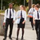 private schools push parents to exploit school voucher programs: group of private school students in uniform walking outside