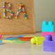 America’s most popular autism therapy may not work and may seriously harm patients’ mental health: cork board with "ABA" spelled out and colorful building blocks in foreground