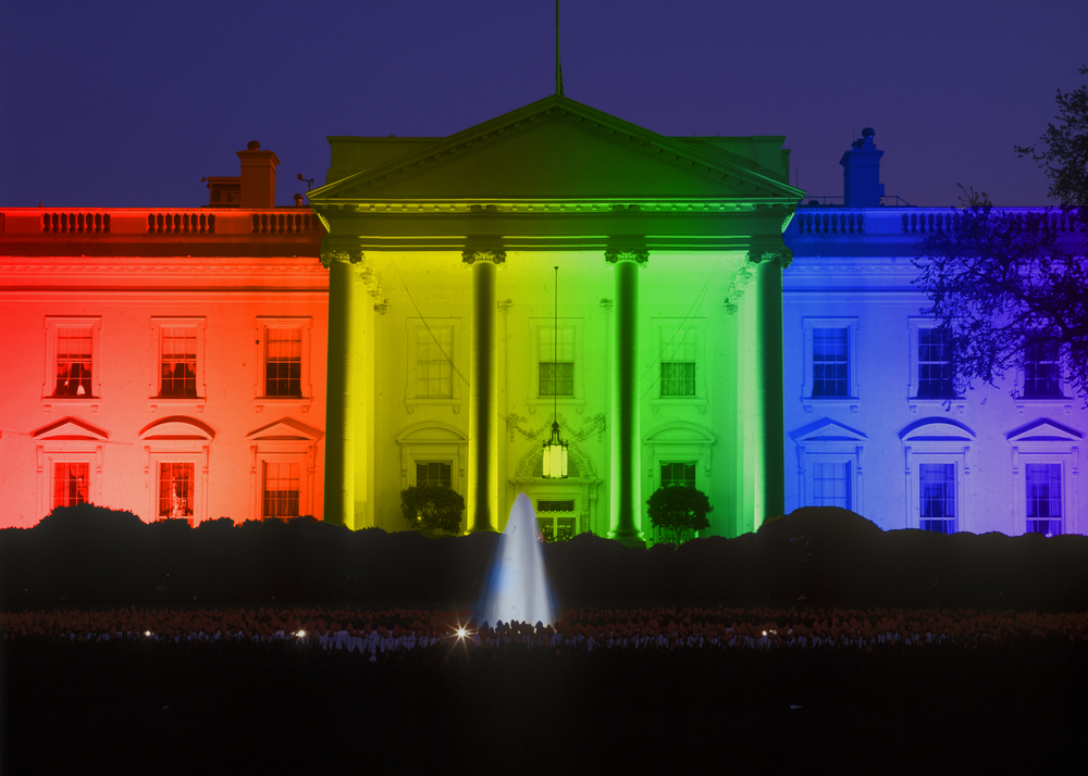 Title IX changes: White House in evening, Washington, DC with Rainbow Flag projected onto it, symbolizing screen court decision for the right of LGBT (Lesbians, Gays, Bisexuals and Trans-genders to marry).