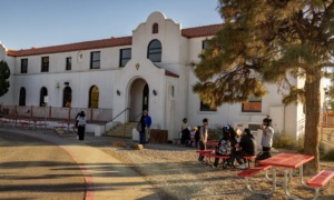 Native American charter schools: Adobe Spanish style off-white, 2-story large building