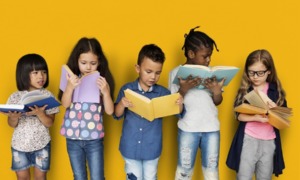 reading and knowledge in preschool: young children standing with books