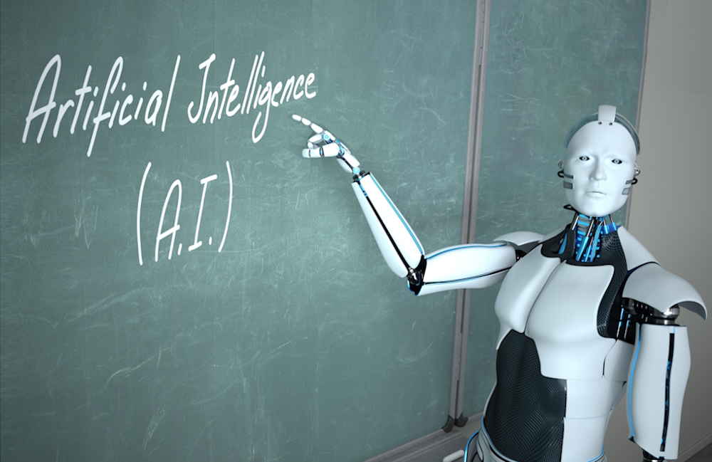 AI usage by teachers: Humanoid white robot looking into camera points to the green chalkboard with the text "Artificial Intelligence."