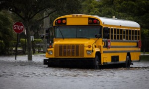 Schools after disasters, rebuilding after Helene and Milton: school bus stopped in flood waters