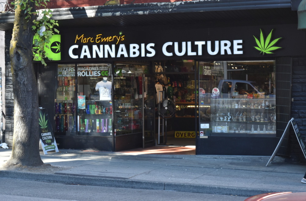 Cannabis dispensary near schools: Cannabis dispensary storefront wit sign, "Cannabis Culture" in white text on black next to image of green marijuana leaf