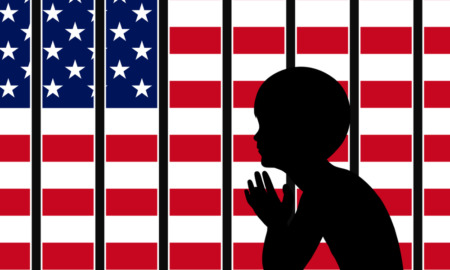 Immigrant arrests in schools: Black silhouette of profile young child sitting leaning forward with hands clasped and elbows on knees in front of illustration American flag cut into strips